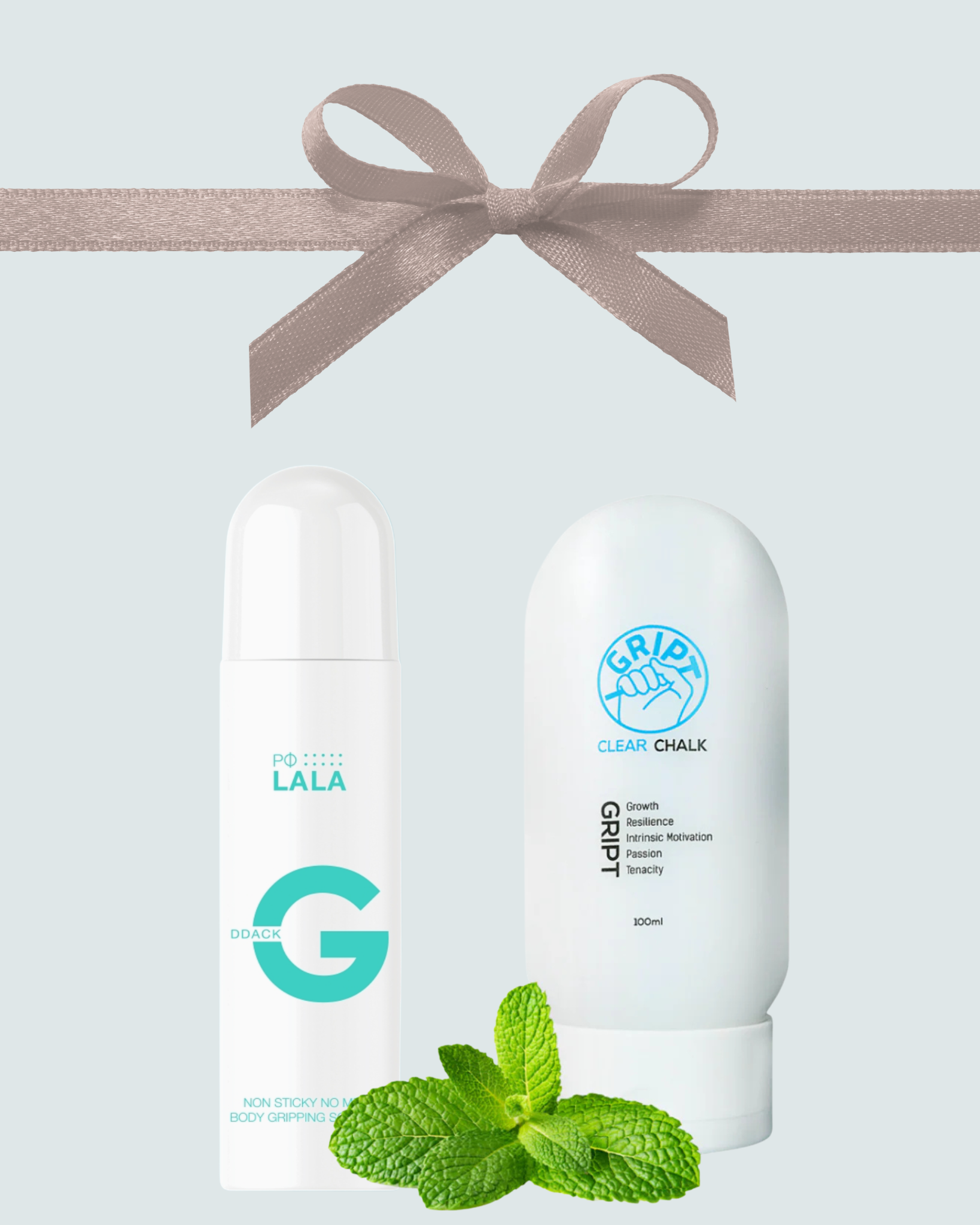Two skincare products with a bow and mint leaves on a light blue background