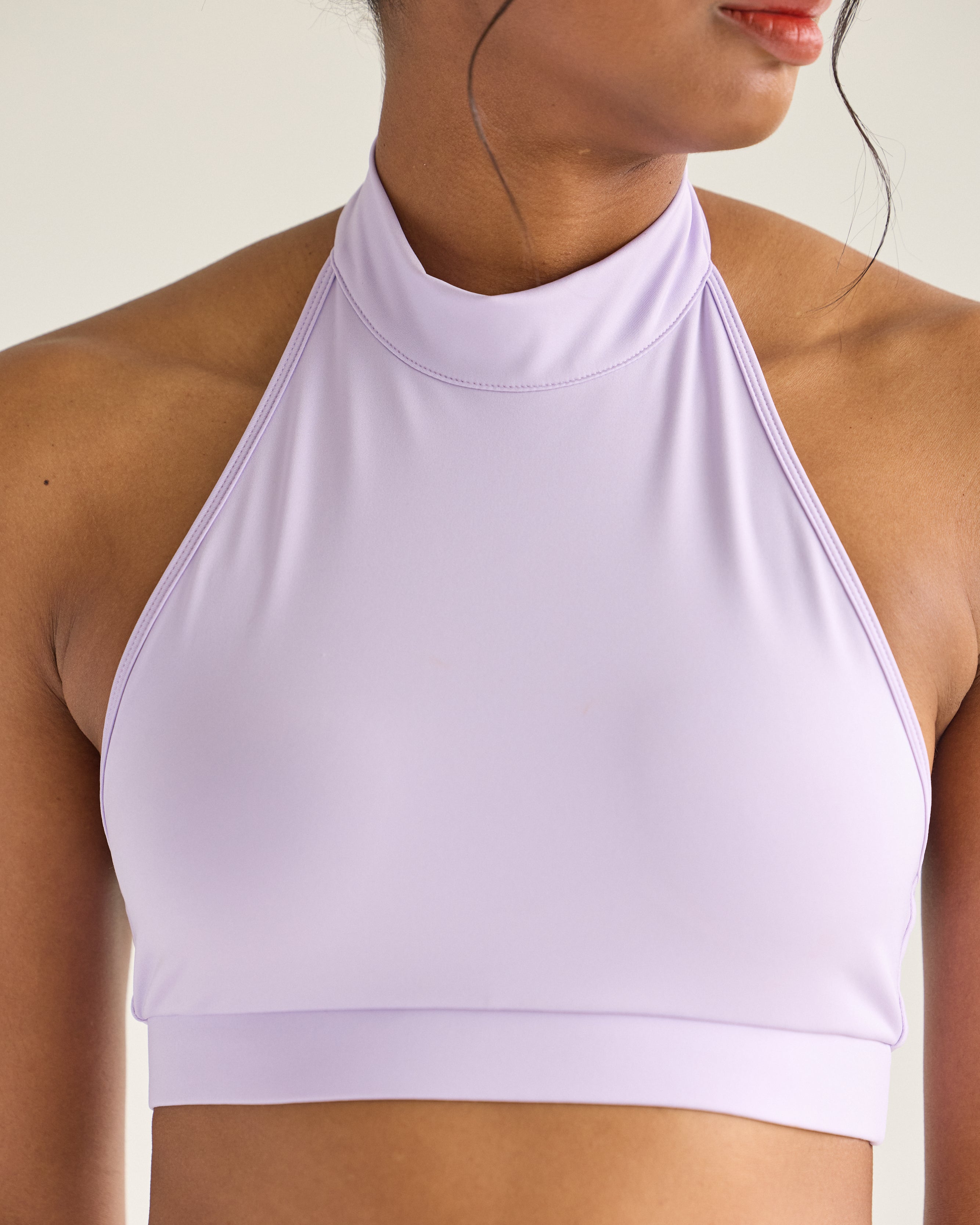 Model in lavender Wings Skort Set – halter top pole outfit