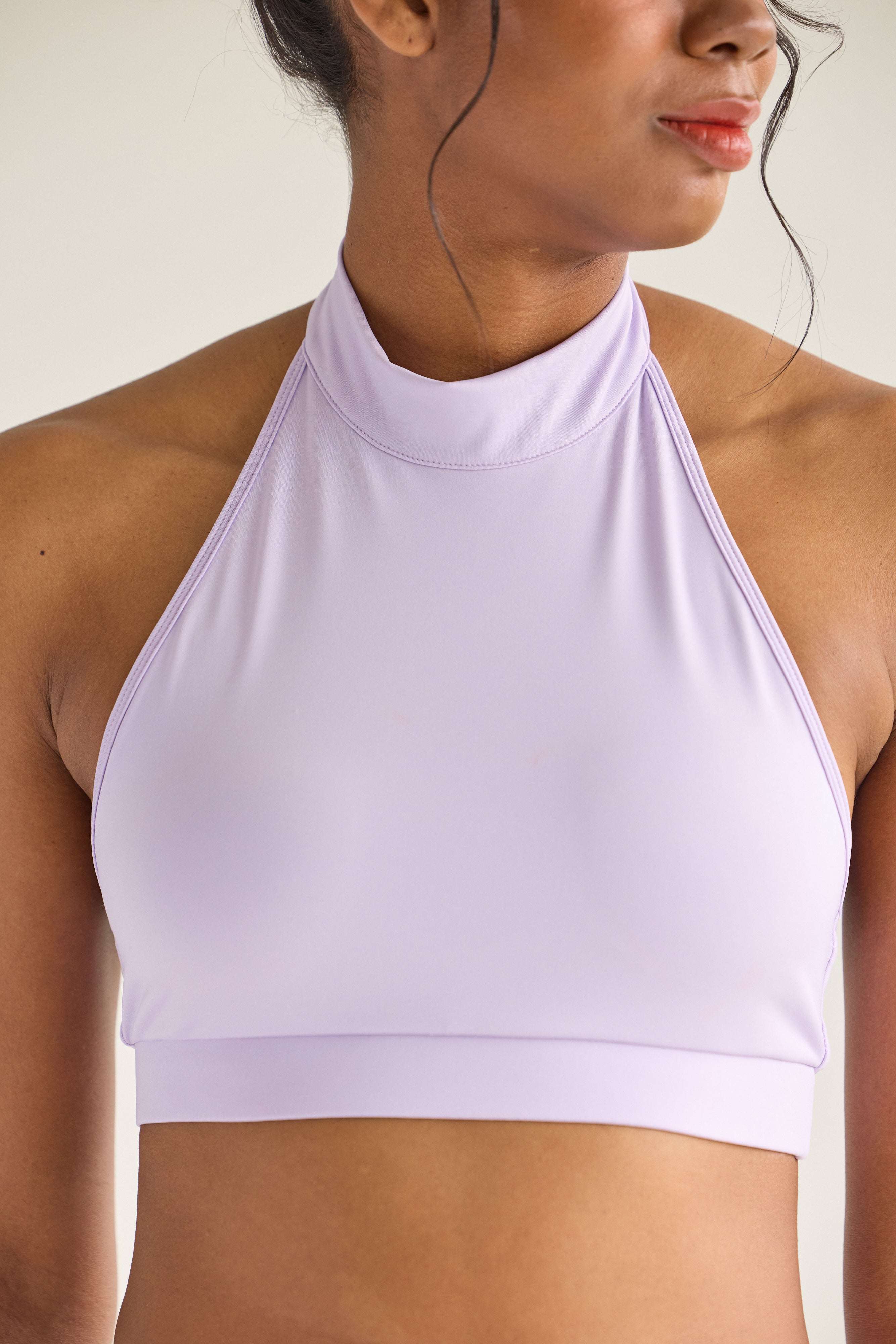 Model in lavender Wings Skort Set – halter top pole outfit