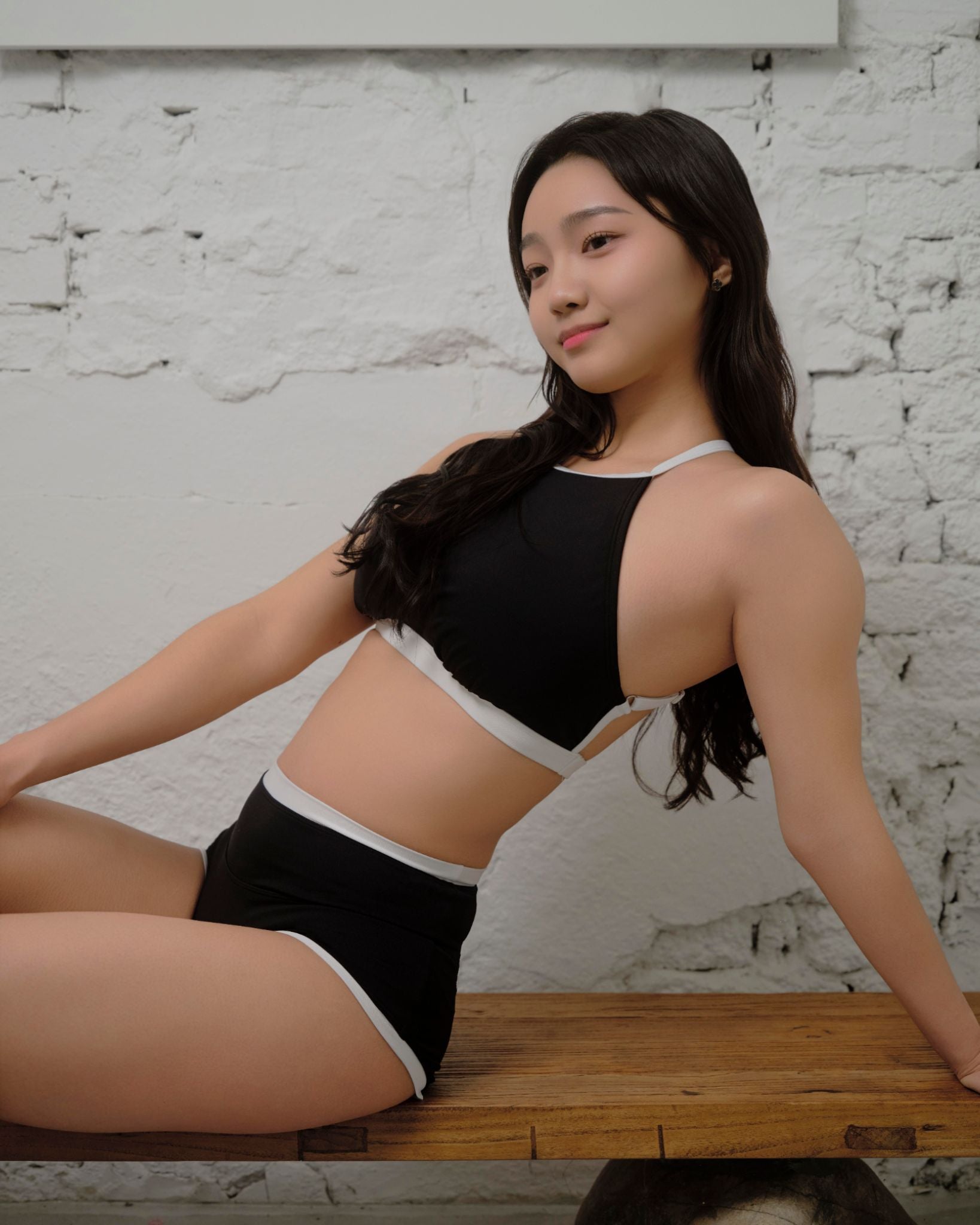 Sustainable black Haru Daily Set polewear outfit with coverage high rise shorts