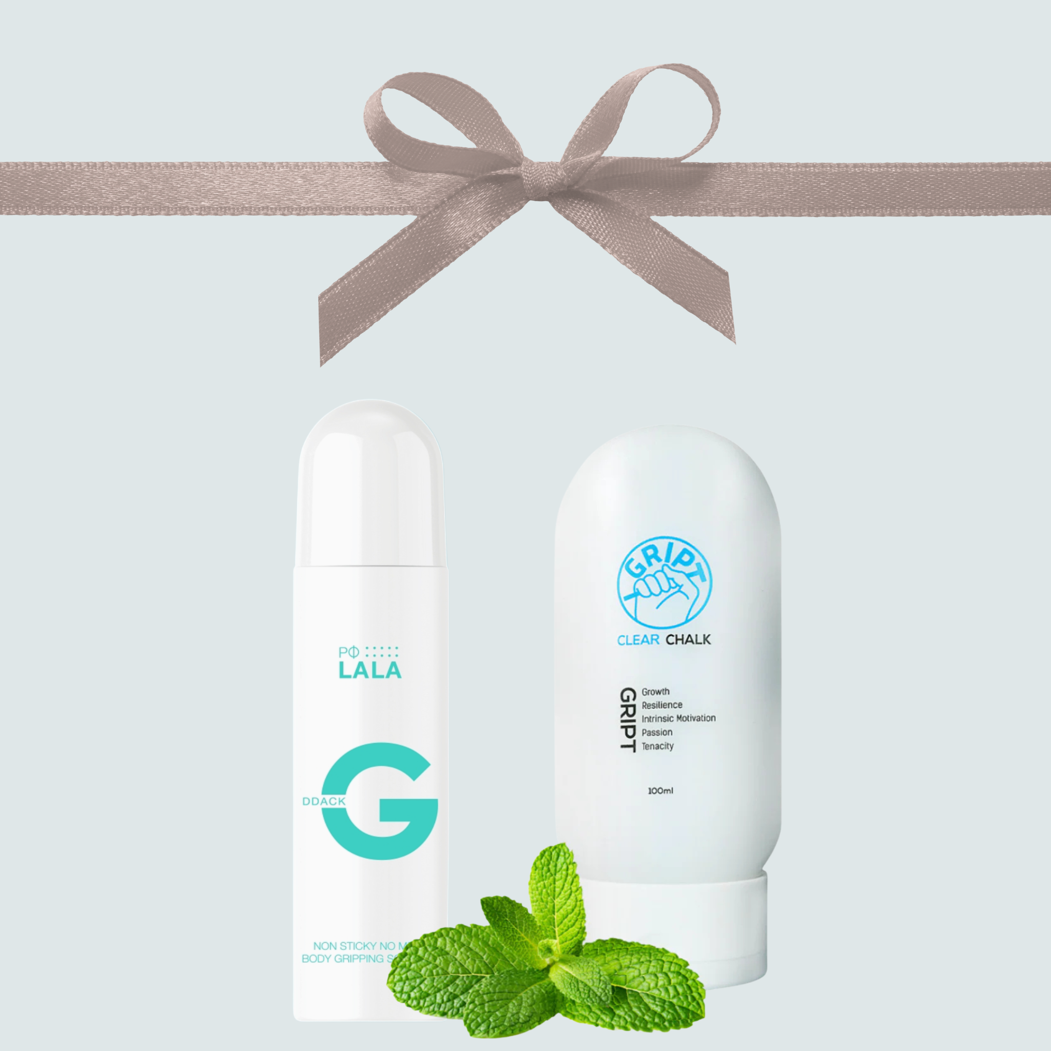 Two skincare products with a bow and mint leaves on a light blue background
