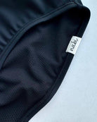 Close-up of the Metamorphosis Signature Set - Black, showcasing the eco-friendly fabric and soft inner lining. Designed for durability and comfort in sizes S, M, L.