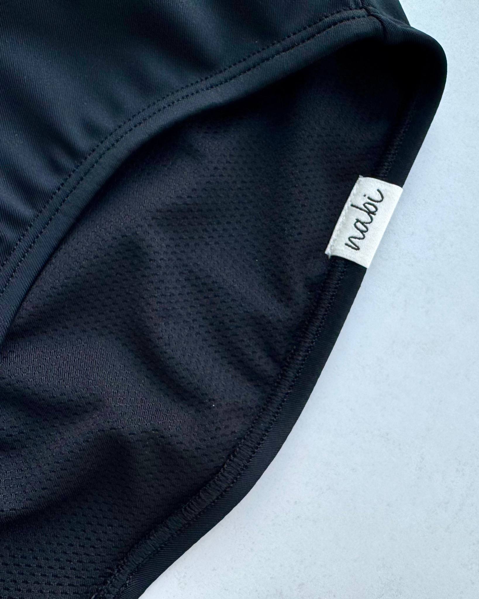 Close-up of the Metamorphosis Signature Set - Black, showcasing the eco-friendly fabric and soft inner lining. Designed for durability and comfort in sizes S, M, L.