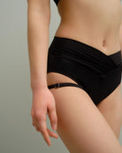 Close-up of the Metamorphosis Signature Set - Black bottom, featuring adjustable and removable garter straps. Available in sizes S, M, L for a perfect fit.

