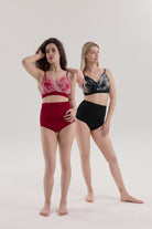 Models posing in Cloud Set black and red – pole dance outfits with sculpted high-waist shorts