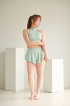 Model in mint Wings Skort Set – sustainable pole outfit halter top with skort